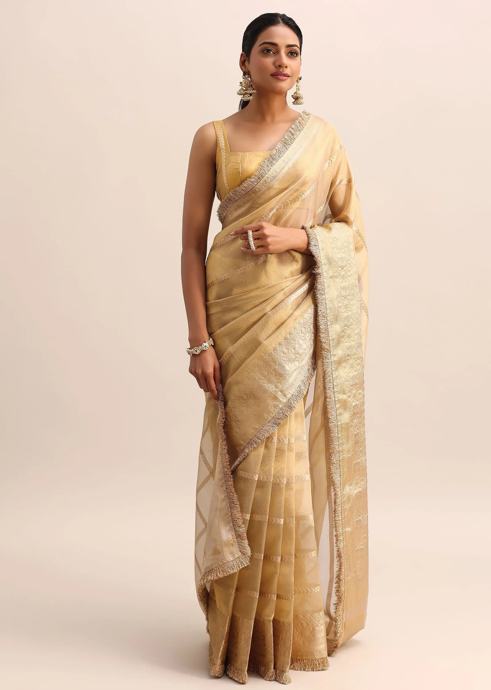 Champagne Gold Silk Saree with Zari Woven Border and Frill Detailing ✨🥂
